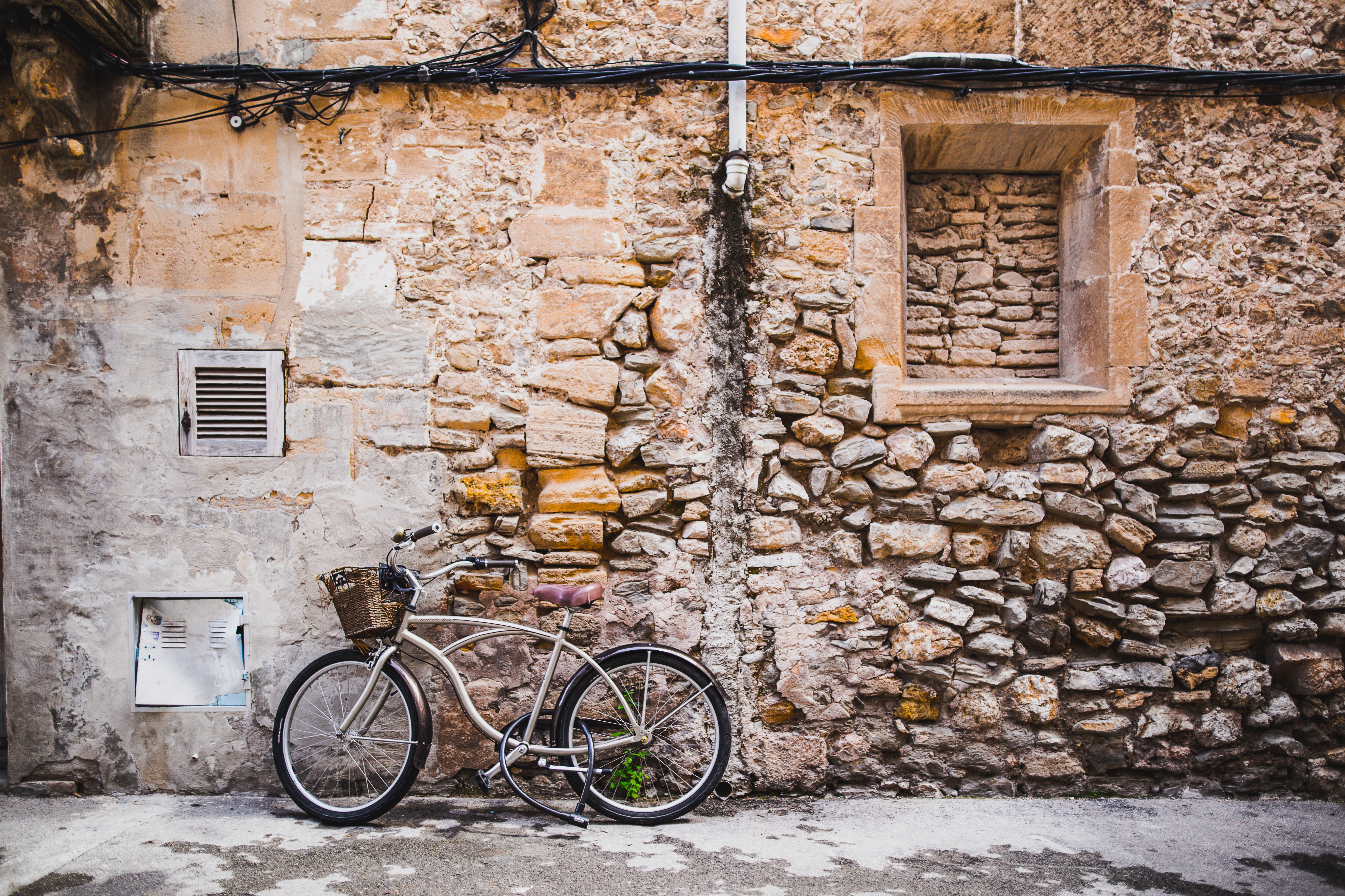 Bike, wall, stones and building